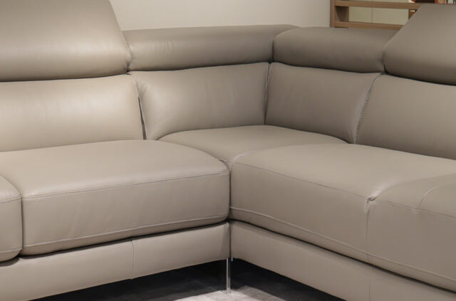 Natuzzi B619 grey leather corner sofa close up